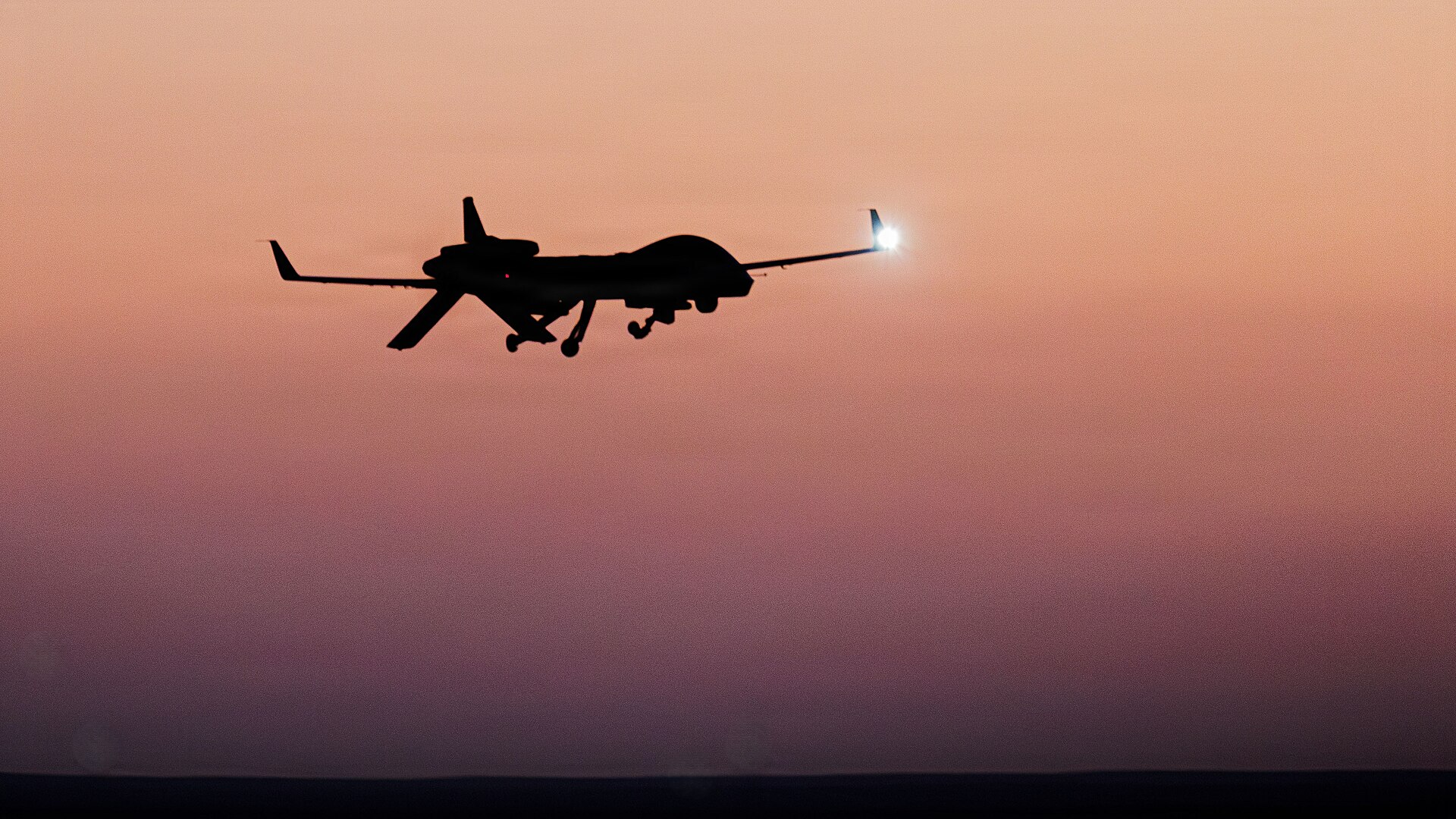 Silhouette of an unmanned aerial vehicle at dusk
